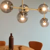 Shop Dyberg Larsen Como suspension, à 5 lampes, laiton