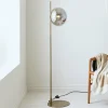 Outlet Markslöjd Lampe sur pied Dione, laiton/gris fumée, verre, fer